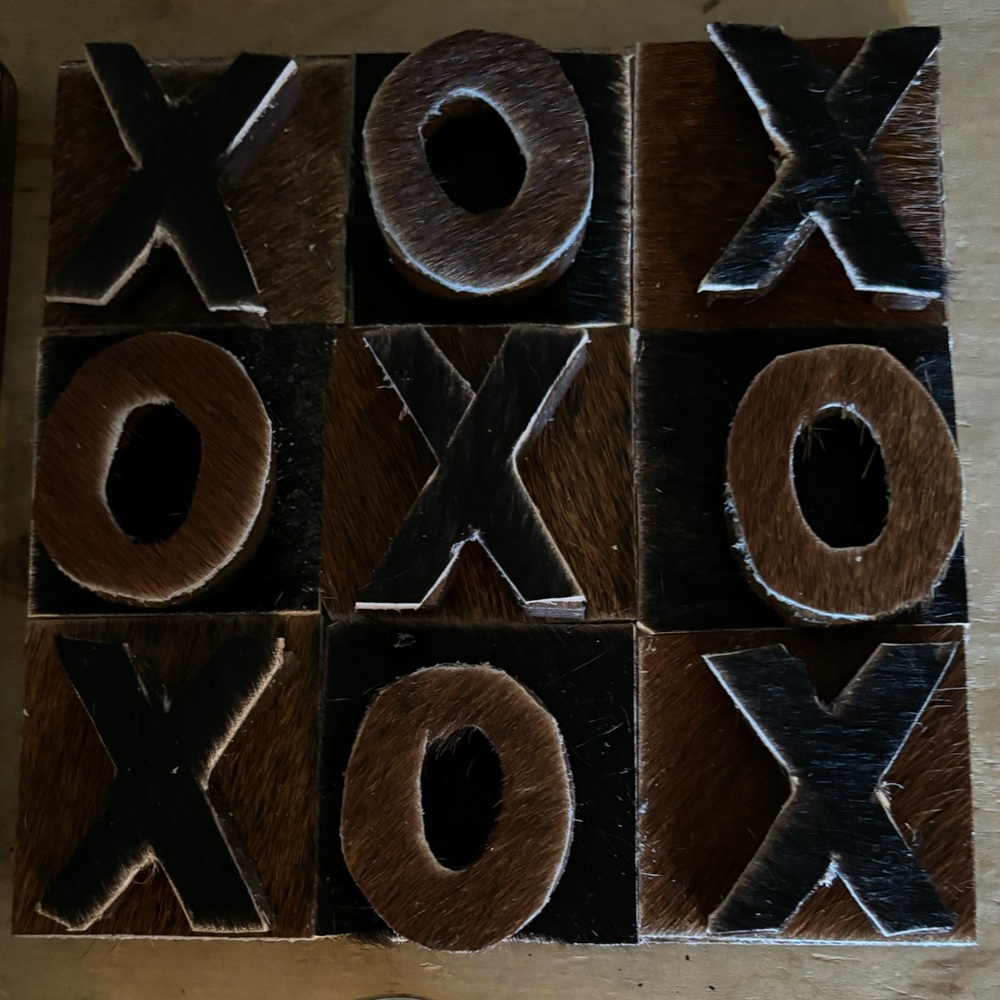 Cowhide Tic Tac Toe Game made from genuine hair on hide. Wood board and pieces